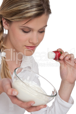 Healthy lifestyle series - Woman holding strawberry with yogurt
