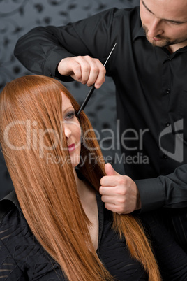 Professional hairdresser with fashion model at luxury salon