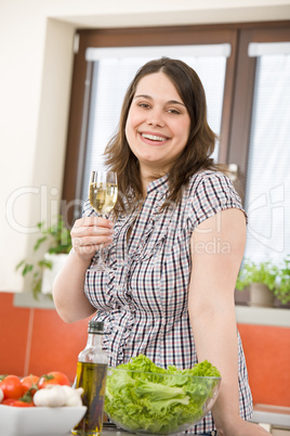 Cook - Plus size woman with white wine and salad