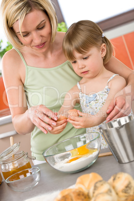 Baking - Woman with child preparing dough