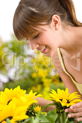 Gardening - portrait of woman with sunflower