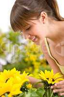 Gardening - portrait of woman with sunflower
