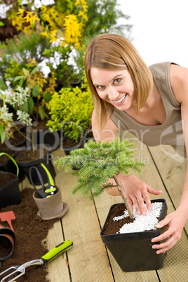 Gardening - woman with bonsai tree and plants