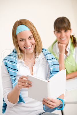 Student at home - two young woman study together