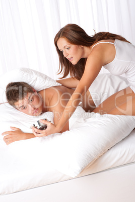 Young couple getting up in the morning