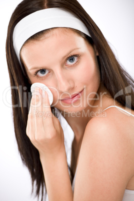 Facial care - woman removing make-up