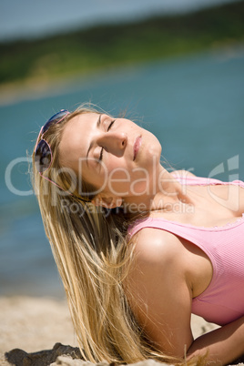 Blond woman relax in summer sun