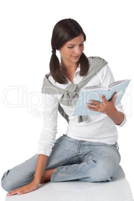 Attractive teenager reading book