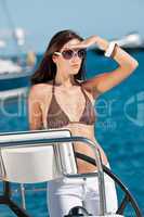 Young woman sailing on luxury yacht