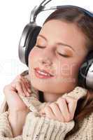 Portrait of happy woman enjoying music with headphones