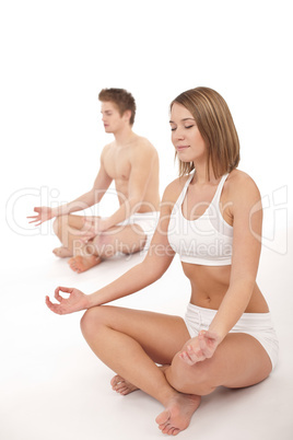 Fitness - Healthy couple stretchin in yoga position