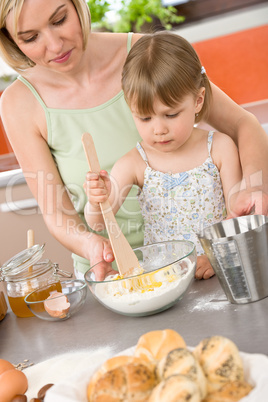 Baking - Woman with child preparing dough