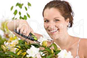 Gardening - woman cutting flower with pruning shears