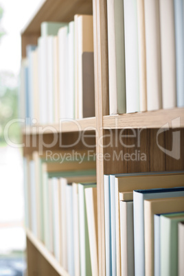 Library -  row of books on bookshelf