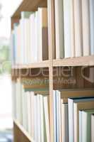 Library -  row of books on bookshelf