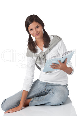 Attractive teenager reading book