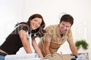 Smiling man and woman working