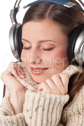 Portrait of happy woman enjoying music with headphones