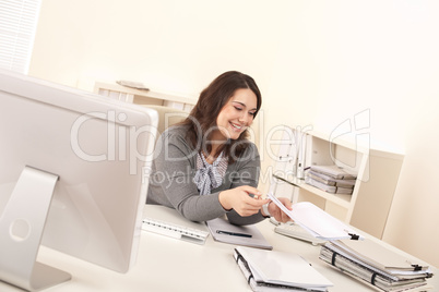 Young business woman working at office