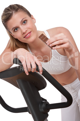 Fitness series - Woman holding piece of chocolate