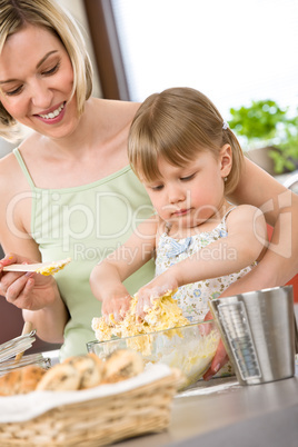 Baking - Woman with child preparing dough