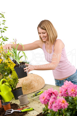 Gardening - Smiling woman holding flower pot