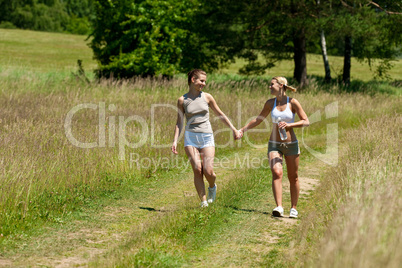 Female couple walking in nature