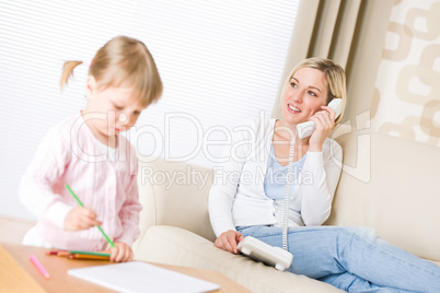 Little girl draw with color pencil in lounge