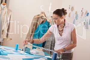 Female fashion designer working at studio