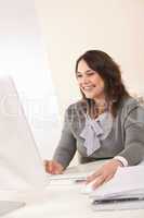 Young business woman working at office