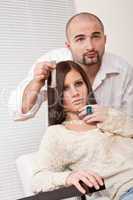 Professional hairdresser choose hair dye color at salon