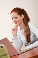 Long red hair business woman at office