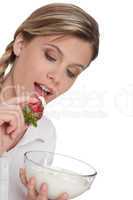Healthy lifestyle series - Woman eating strawberry with yogurt