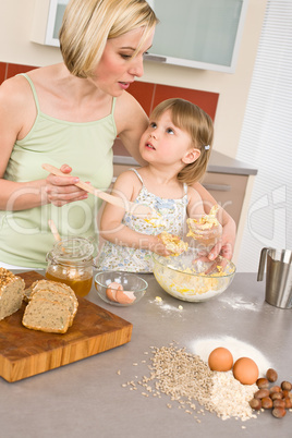 Baking - Woman with child preparing dough