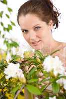 Gardening - Woman with Rhododendron flower blossom