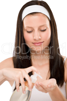Body care - woman applying massage oil