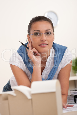 Young female architect with architectural model