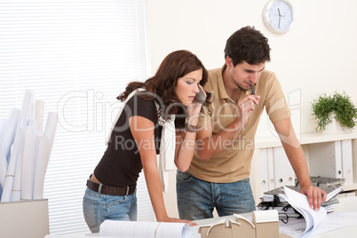 Young man and woman working at architect office