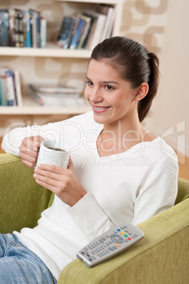 Students - Happy female teenager atching television