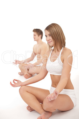 Fitness - Healthy couple stretchin in yoga position