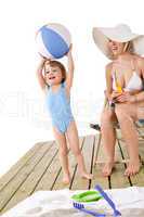 Beach - Mother with child playing with toys