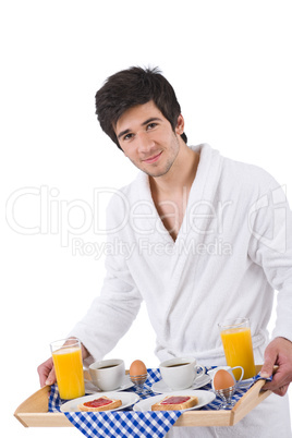 Breakfast - young man holding tray with breakfast