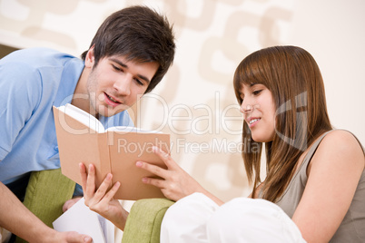 Student - two teenager reading book in lounge