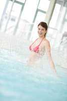 Swimming pool - happy woman under water stream