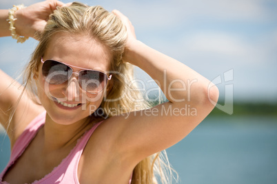Blond woman with sunglasses enjoy sunny day