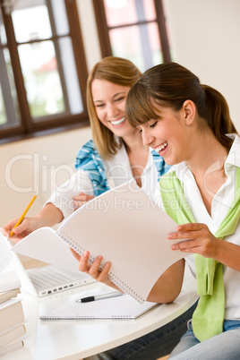 Student at home - two happy woman with laptop