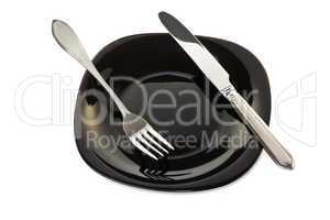 Black plate with fork and knife