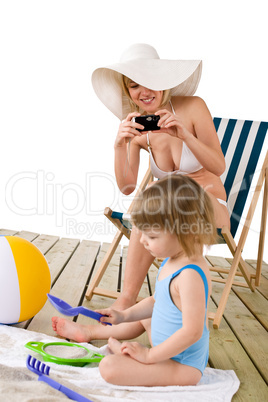 Beach - Mother with child taking photo with camera