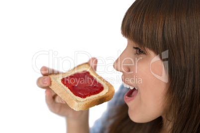 Happy teenager eat healthy toast for breakfast