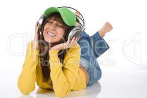 Happy female teenager enjoy music